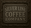 Silver Line Coffee Company sign with barbed wire on a dark background